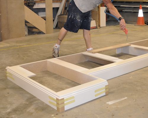 fabricating cabinets, assembling the cabinets, bases